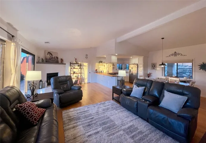 Comfortable living room with fireplace and access to outdoor living areas.