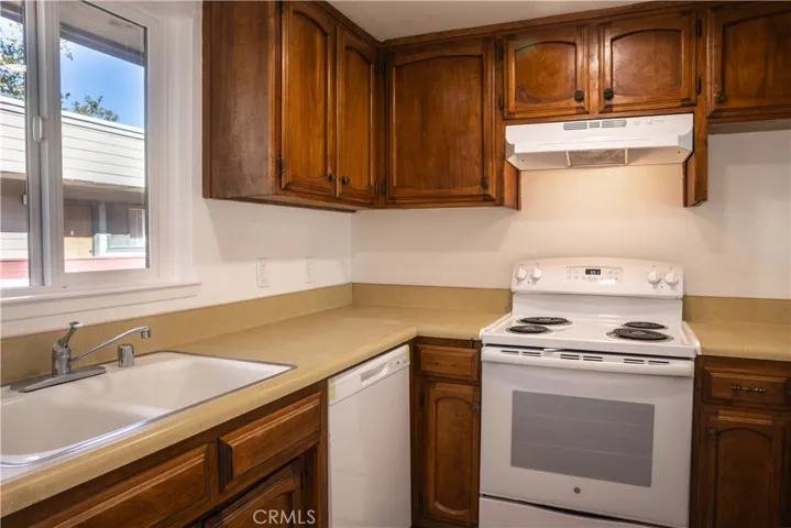 Functional and clean kitchen, with new dishwasher & range, is ready for your taste and vision