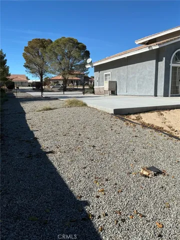 SIDE OF HOME WITH DOUBLE GATES