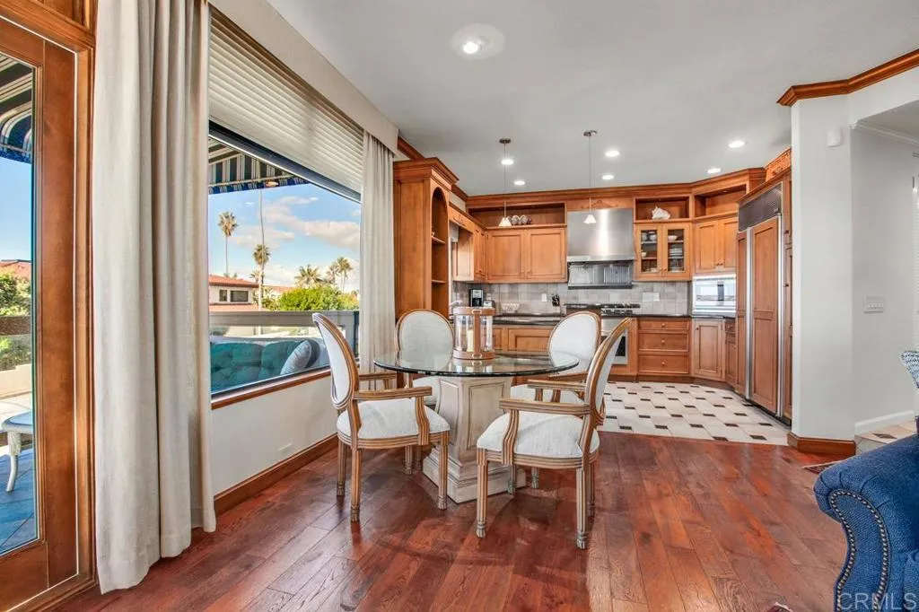 View of dining area with kitchen beyond