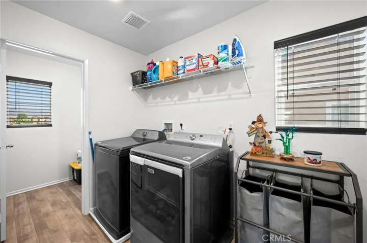 Large laundry room w/additional storage room