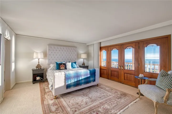 Primary Ocean View bedroom w balcony