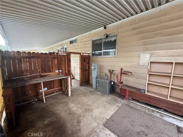fenced in work area in carport
