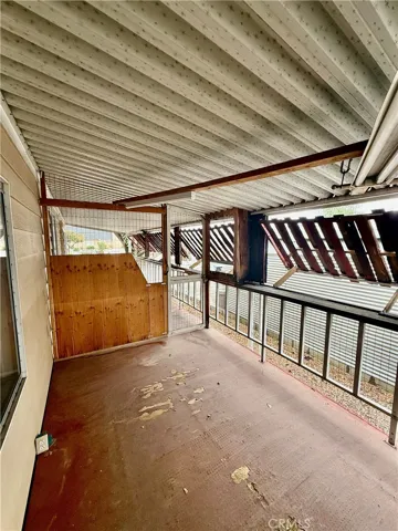 Fenced in area for a pet on porch