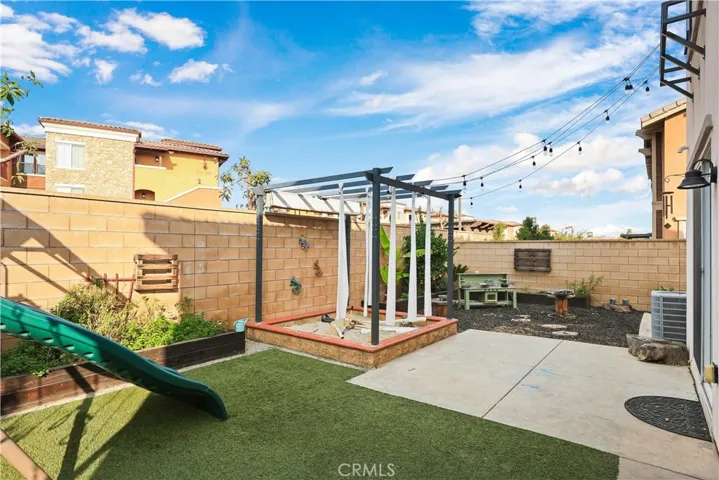 Relaxing fun backyard with sandbox