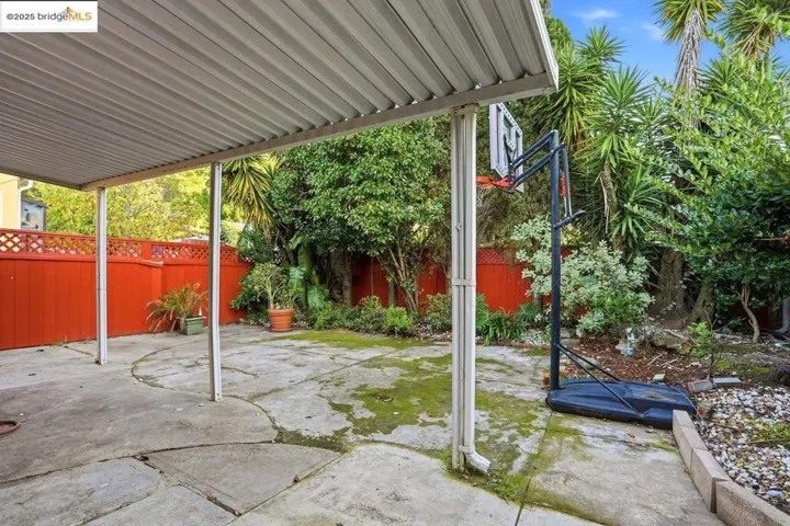 Fenced backyard with a patio area