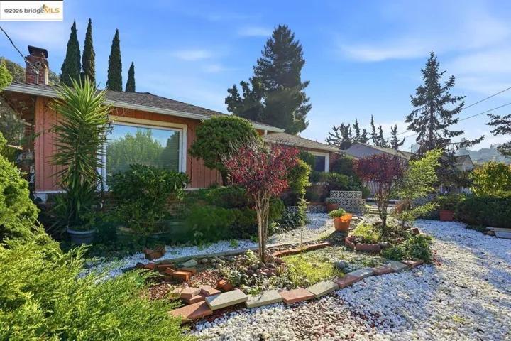 View of side of property with a chimney