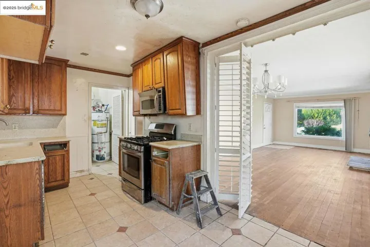 Kitchen featuring  appliances with stainless steel finishes, brown cabinetry