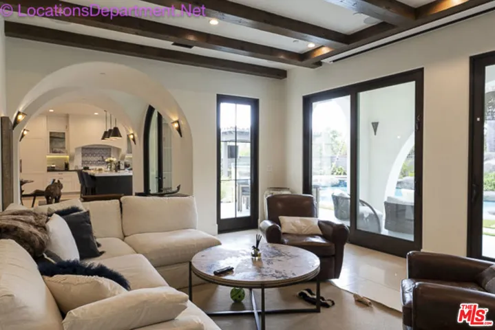 Living room w/ views of pool