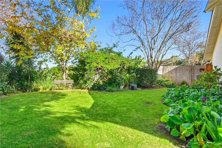 Large front side yard with mature landscaping!