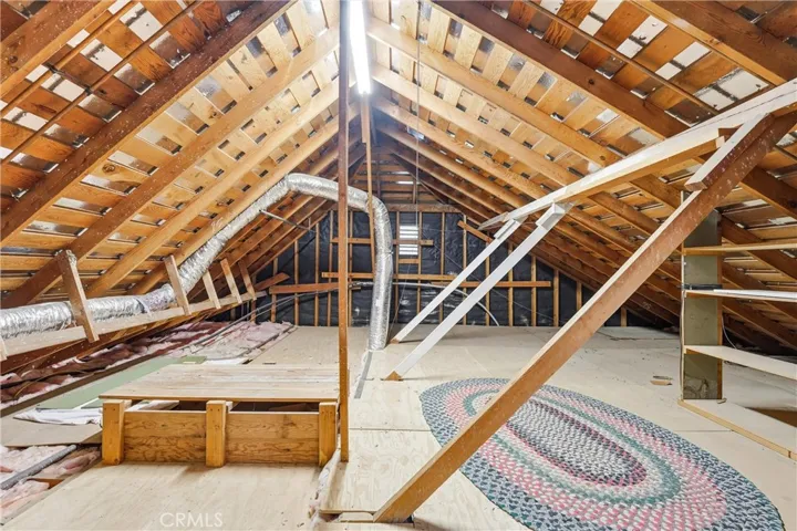 Walk into the attic from the second floor...there is TONS of storage space and room to walk around!