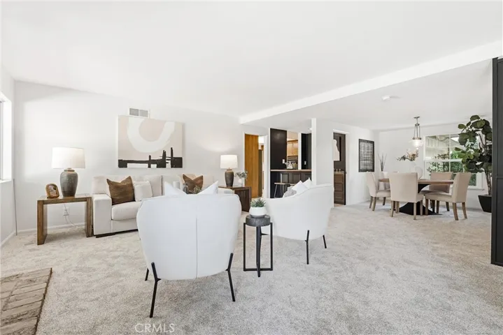 Formal Living Room is open to the Formal Dining Room and the bar!