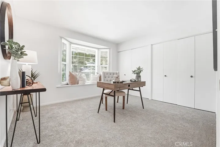Downstairs Bedroom #3 has a wall of closets and a large window seat!