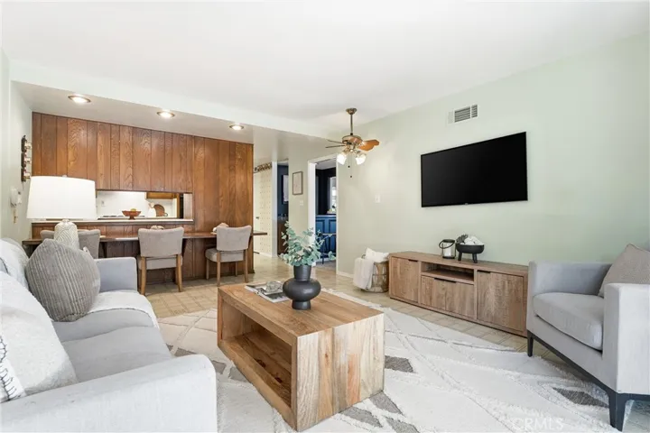 Family Room sits off the Kitchen and has new paint and seating at the kitchen bar area!