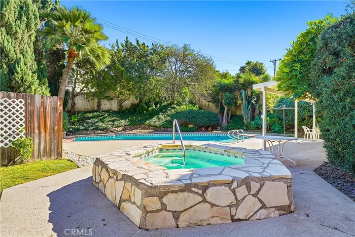 Mature landscaping has been loving cared for and offers year-round beauty!