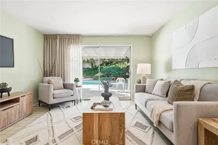 Views of the covered patio and inviting pool from the Family Room!