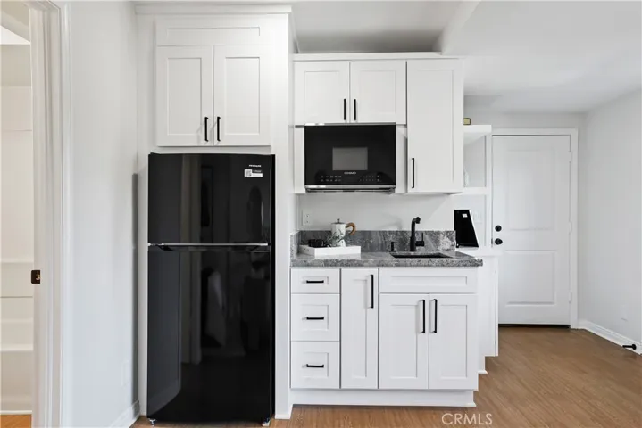 Kitchen has a portable cook top