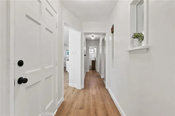 Front door, Kitchen is to the Left. Primary bedroom to the right and 2nd bedroom down the hall
