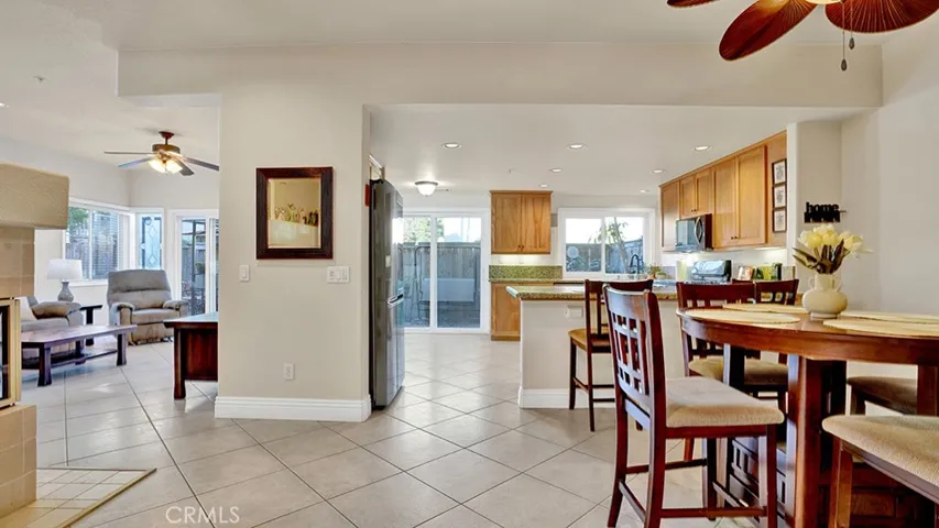 The dining room and kitchen are directly adjacent to one another.