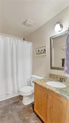 The upstairs guest bathroom has a shower tub combo.