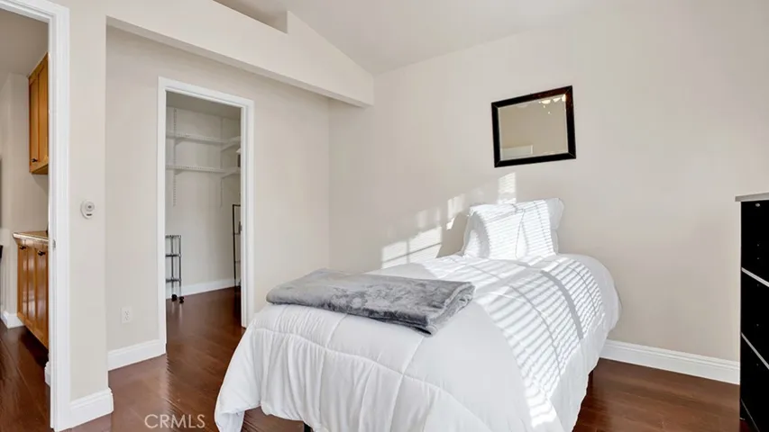 This guest bedroom also features a walk in closet.