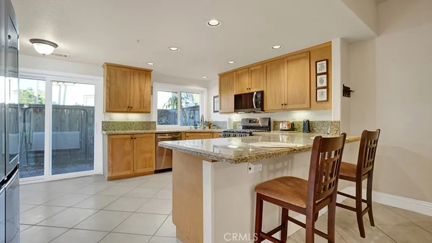 The kitchen is the heart of the home and your kitchen has a sliding glass door leading to your private backyard.