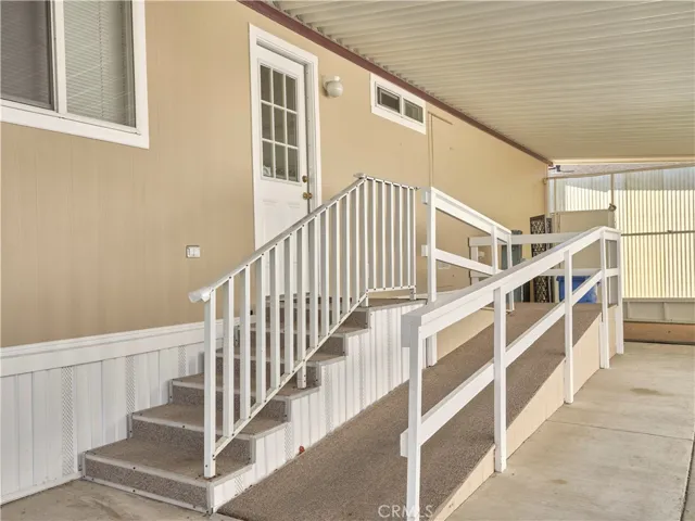Easy access ramp and stairs with cute bonus patio area in back