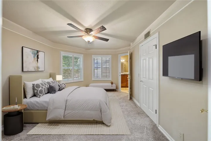 Virtually staged. Upstairs bedroom with en suite bathroom