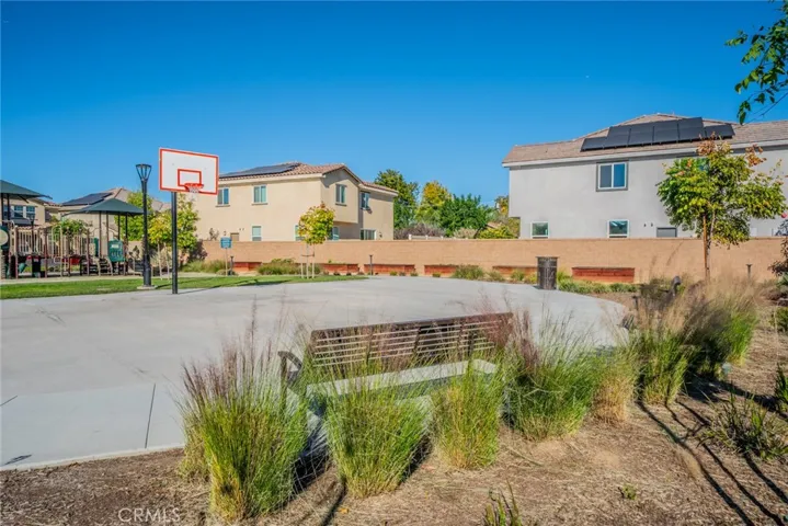 Basketball court and raised planters by the wall to grow your favorite vegetables.