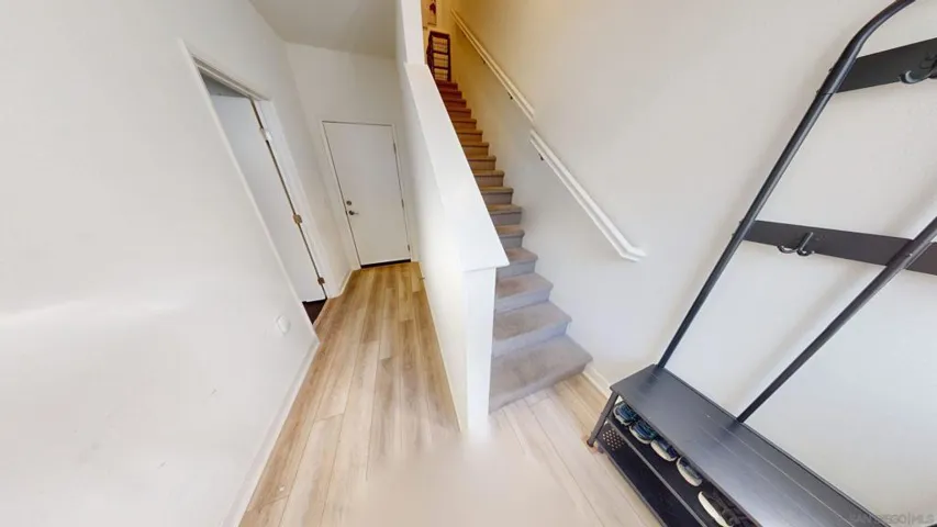 Entry Level to 1st Level Bedroom, Attached Garage and Stairway to Level 2