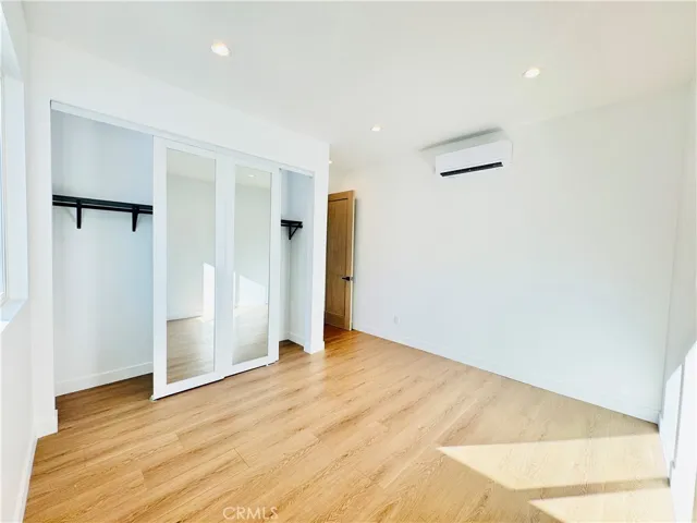 Large closet with mirrored doors