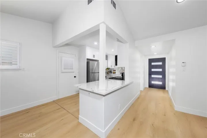 KITCHEN/FRONT ENTRANCE VIEW
