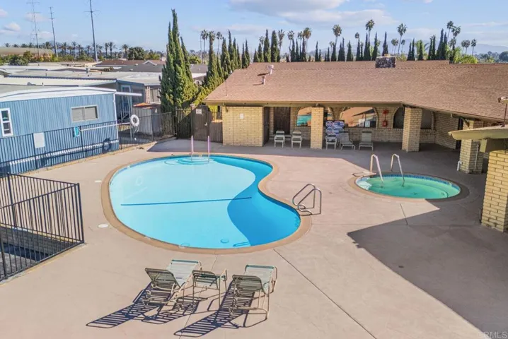 Drone pic overlooking pool and hot tub area
