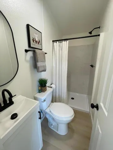 The hallway bathroom is completely renovated with style!