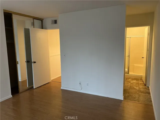 Master Bedroom with Closets, Hallway, and Bathroom View