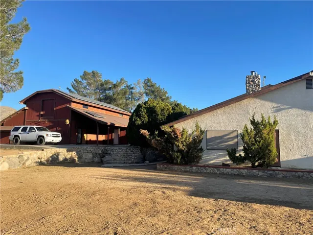 side view of barn and primary home