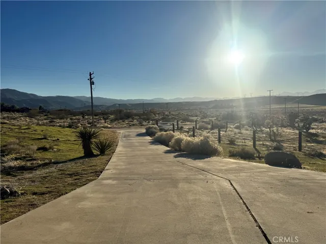 Long view of front concrete pave driveway