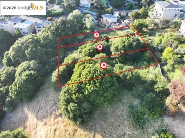 Aerial view of property and surrounding area with property parcel outlined