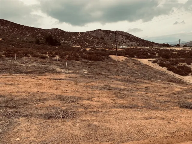 The dirt road on the right is Orange St.