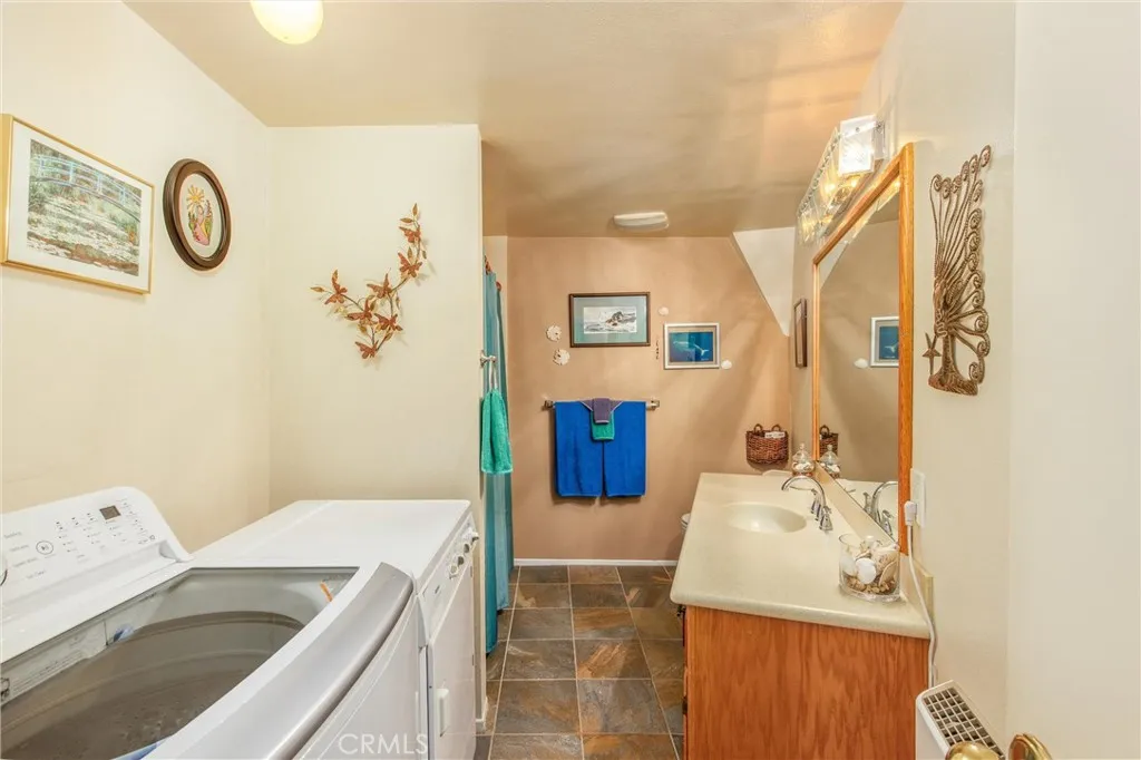 Downstairs Bahtroom with Laundry Area