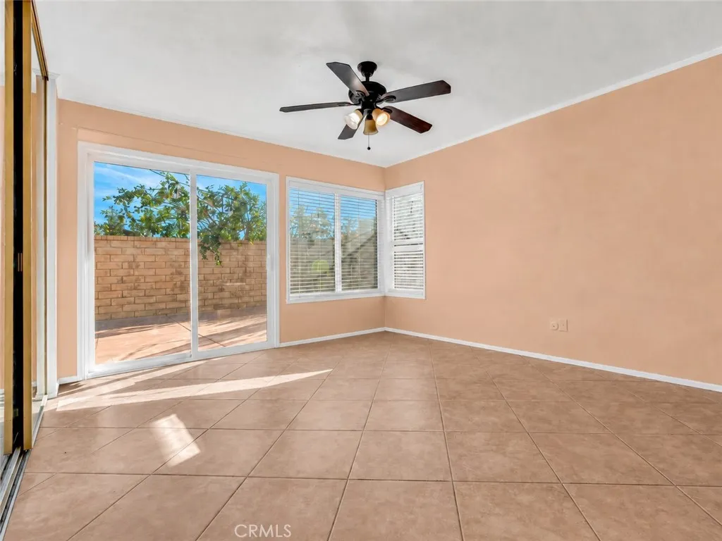 Primary bedroom with sliding door access to backyard
