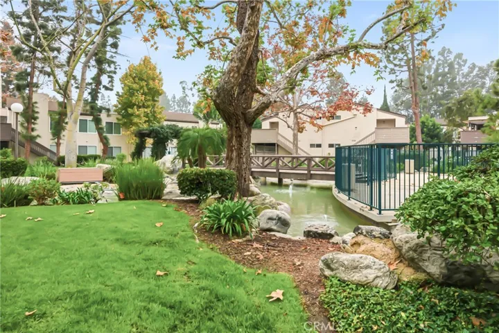 Flowing water ponds, and lush natural landscaping, creating a peaceful, park-like setting.