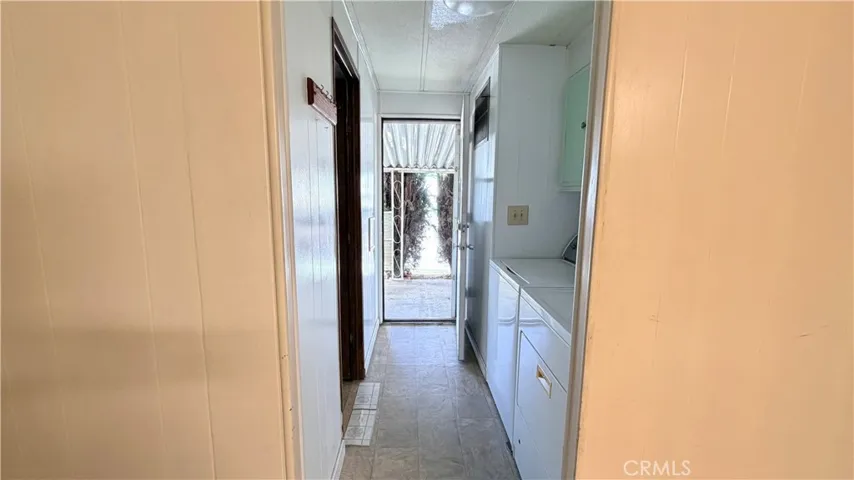 Walkway to bathroom 1, laundry area, and carport