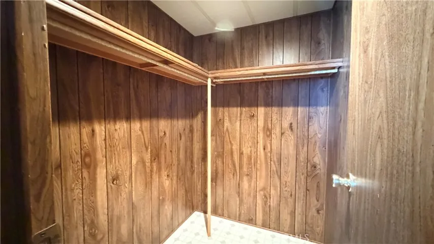 Primary bedroom walk in closet