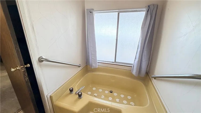 Bathtub in primary bathroom