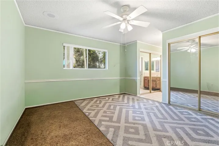 Master bedroom view from the closet and bathroom area