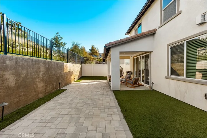 Side yard walkway with low-maintenance landscaping for easy upkeep.