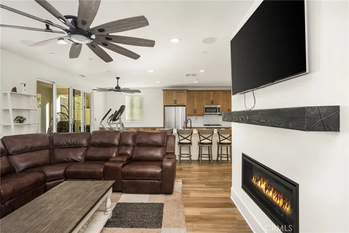 Another family room perspective emphasizing warmth, comfort, and the open layout.