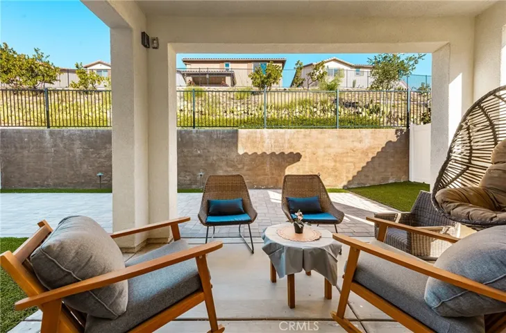 Covered patio offering a relaxing outdoor retreat for dining, lounging, or entertaining.