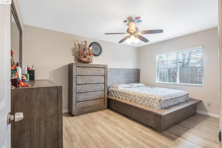 Bedroom featuring light wood-style flooring and a ceiling fan